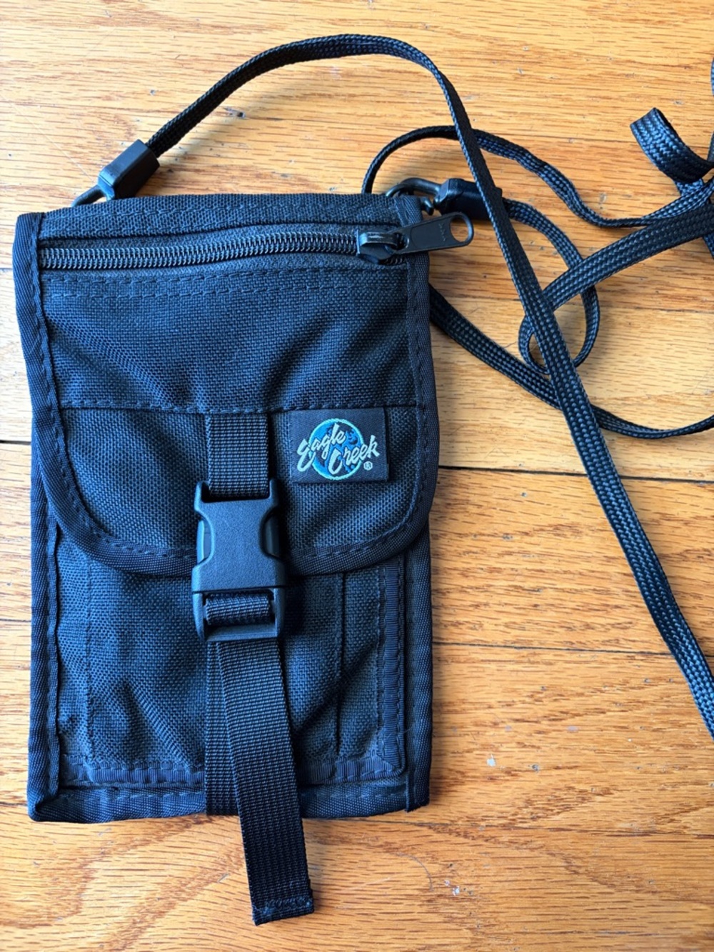 Eagle Creek crossbody wallet with phone, cards and money compartments